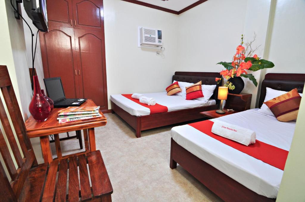 Jilian Tourist Inn Puerto Princesa Pokoj fotografie
